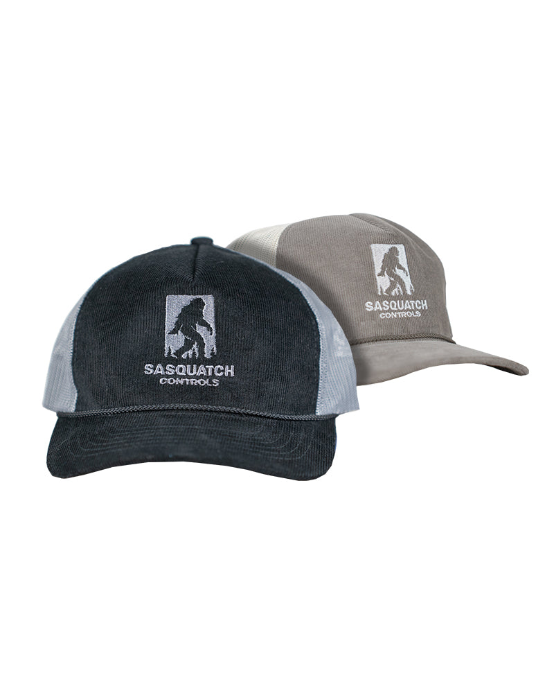 Two corduroy trucker hats, one black and one brown, with 'Sasquatch Controls' embroidered logo.
