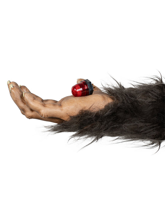 Sasquatch hand holding a small red Sasquatch Controls Beacon Dome Light.
