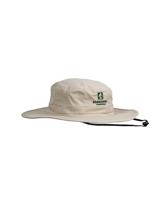 Side angle of cream Sasquatch Controls embroidered bucket hat. 