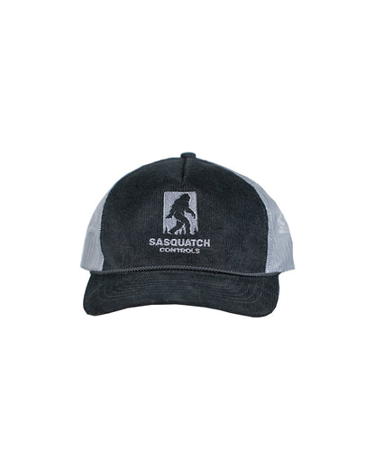Front of black Sasquatch Controls embroidered corduroy trucker hat.