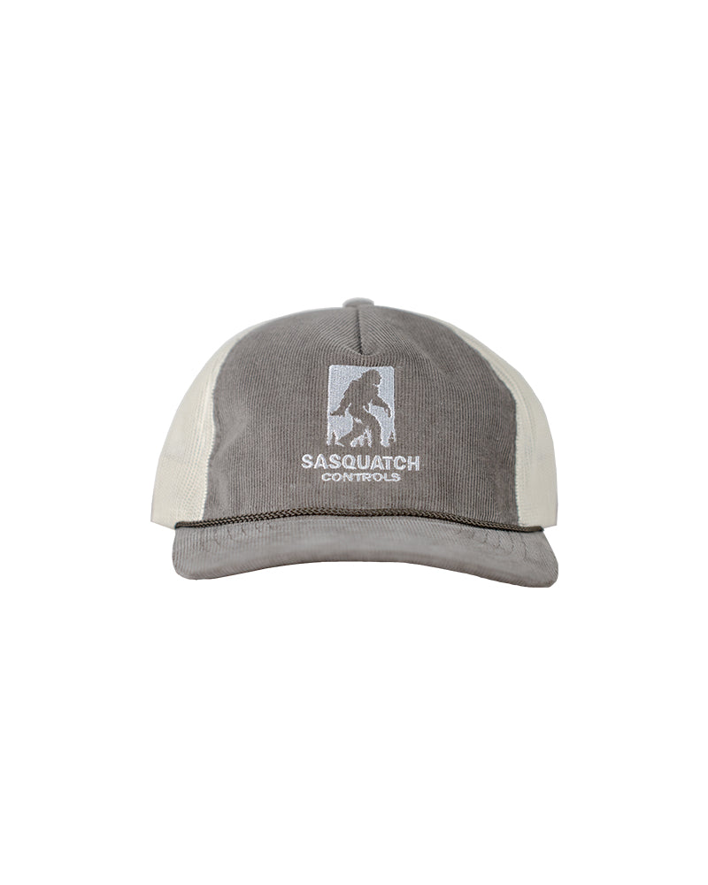 Front of brown Sasquatch Controls embroidered corduroy trucker hat.