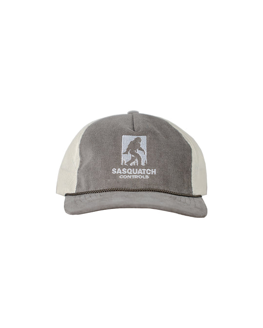 Front of brown Sasquatch Controls embroidered corduroy trucker hat.