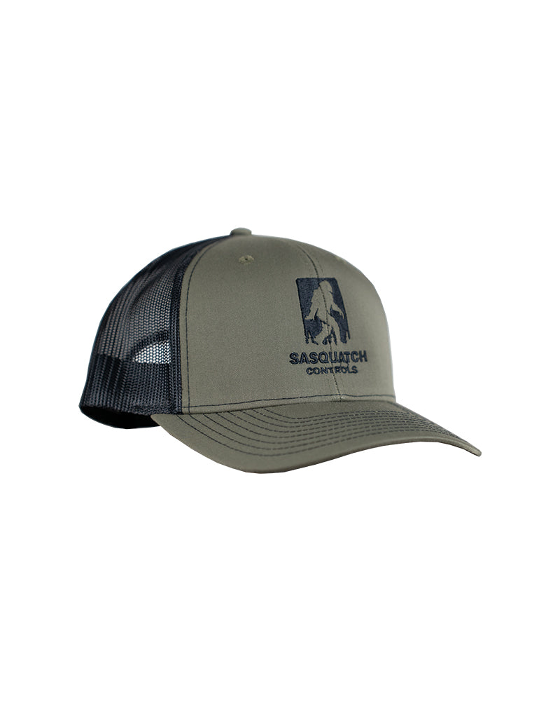 Side angle of green Sasquatch Controls embroidered trucker hat.