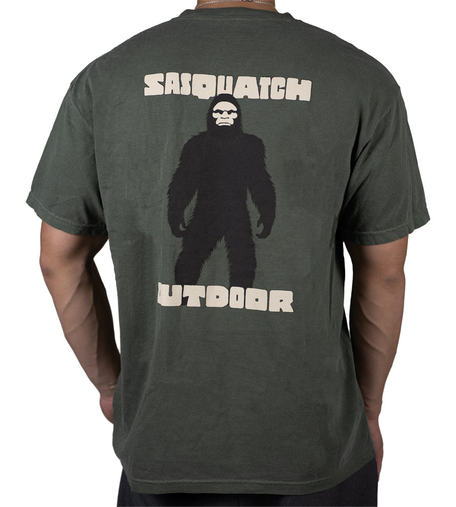 Back of man wearing Sasquatch Outdoor Silhouette shirt in moss